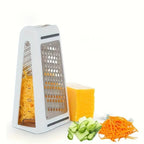 Box grater with sliced vegetables on a white background