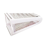 White plastic drying rack with a pink textured mat on a white background