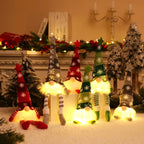 Decorative gnomes with colorful hats and striped socks in a festive setting.