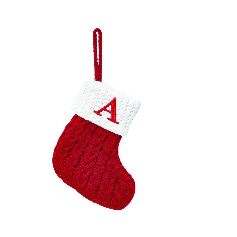 Red knitted Christmas stocking with a white cuff featuring a red letter 'A' on a white background.