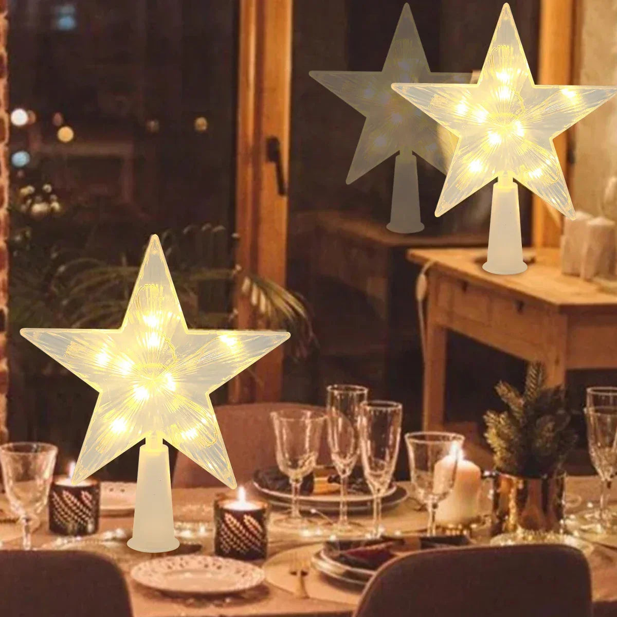 Star-shaped lamp decorations on a table with glasses and candles in a cozy indoor setting.