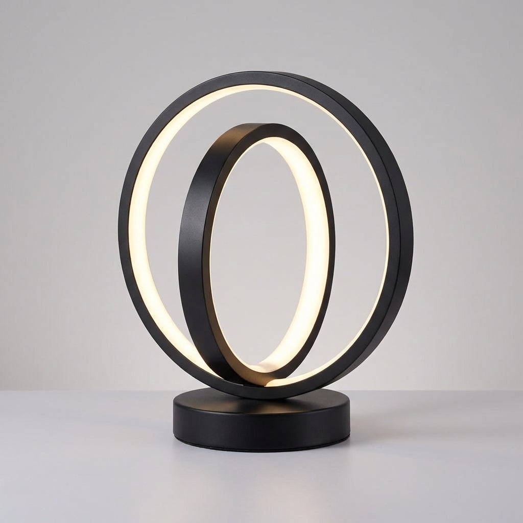 Modern table lamp with two interlocking circular designs on a gray background