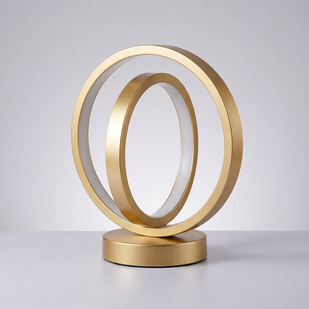 Gold circular sculpture on a gray background