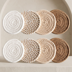 Set of round, textured coasters in white, beige, and brown on a neutral background.