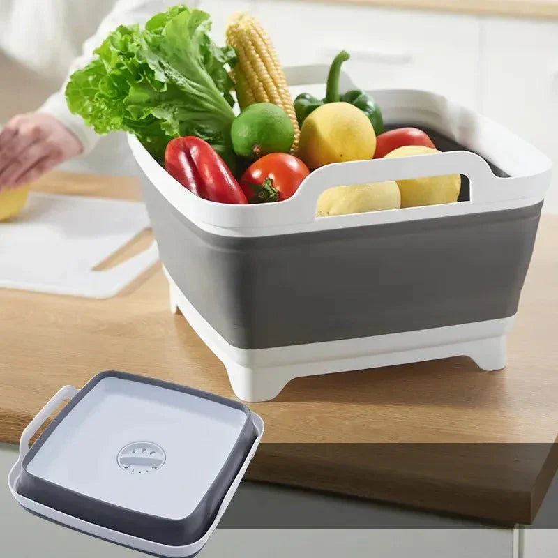 Collapsible fruit and vegetable bin with fresh produce on a wooden surface