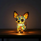 Colorful stained glass lamp shaped like a dog on a dark background