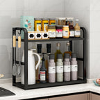 Black kitchen shelf with various items on a tiled wall background