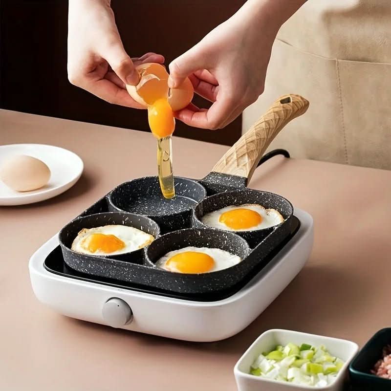 Person cracking eggs into a multi-pan cooking device on a kitchen counter.