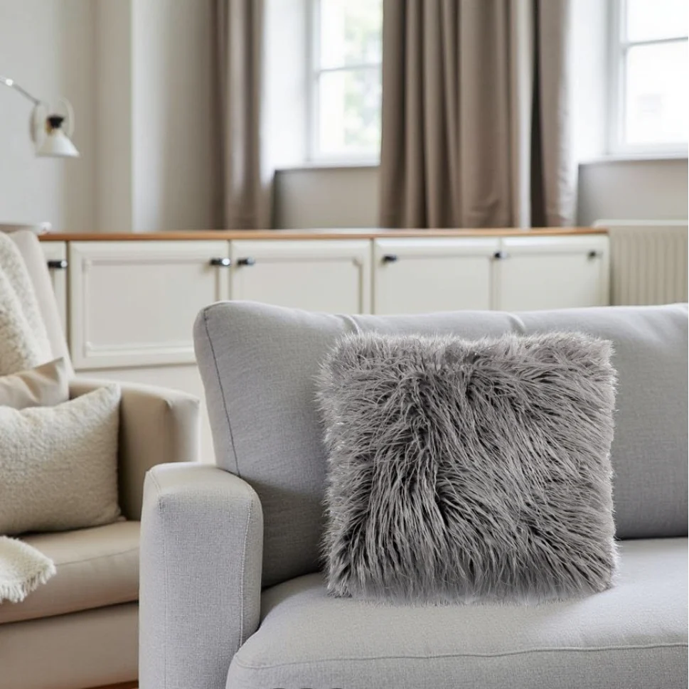 Gray sofa with a fluffy pillow in a living room setting