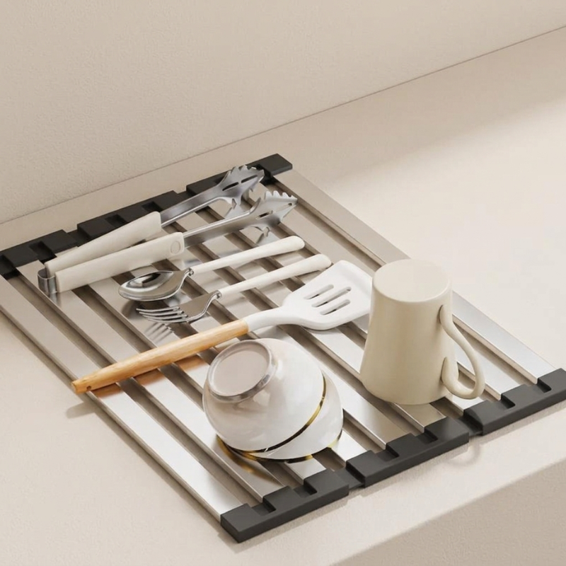 Kitchen utensil rack with various items on a light-colored countertop