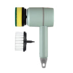 A mint green handheld cleaning brush attachment with a detachable scrubber pad and a separate white bristle brush, shown on a plain white background.