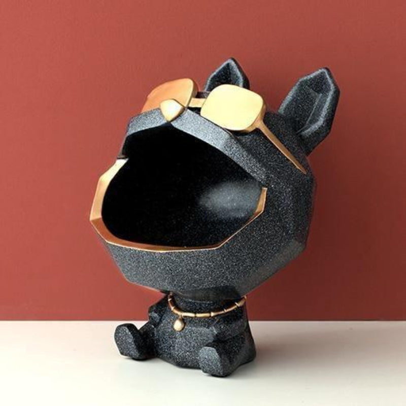 Black and gold decorative object resembling a dog on a red and white background