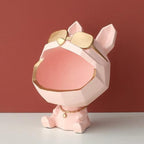 Pink and gold decorative item resembling a dog with sunglasses on a red background