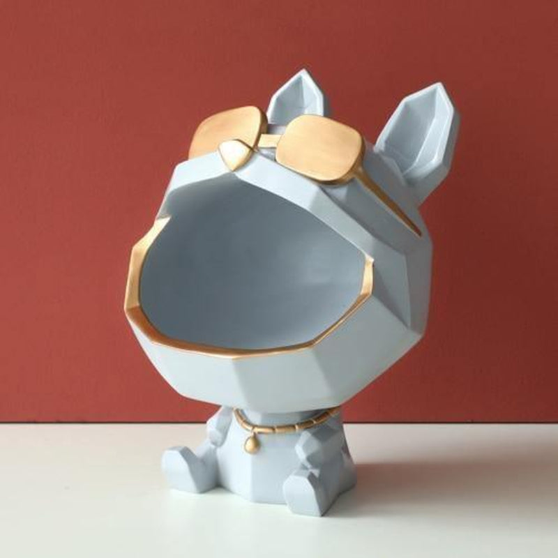Geometric dog figurine with gold accents on a red background