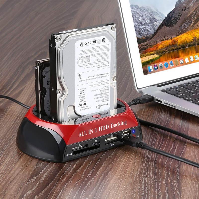 All-in-one HDD docking station with hard drive attached, connected to a laptop on a wooden surface.