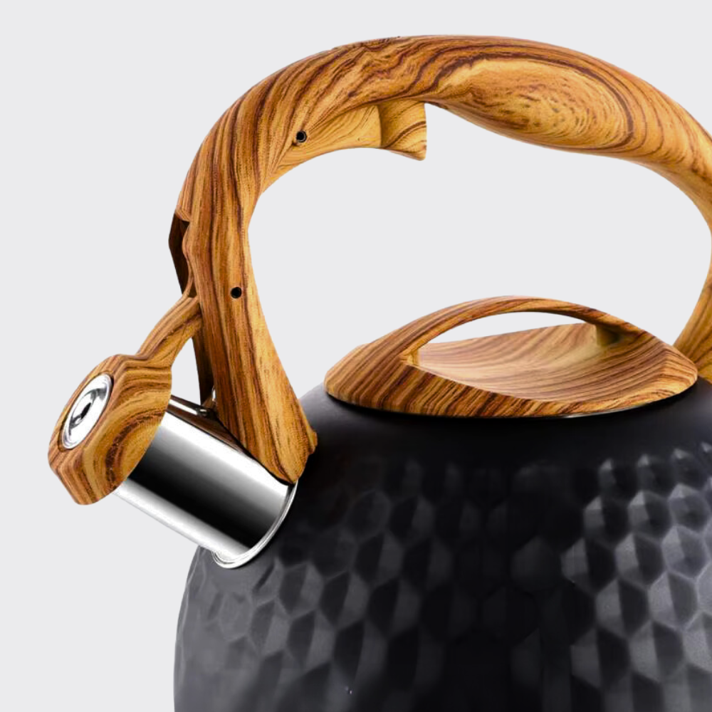 Wooden handle on a black textured surface with a white background
