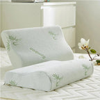 Two gray pillows with bamboo design on a bed