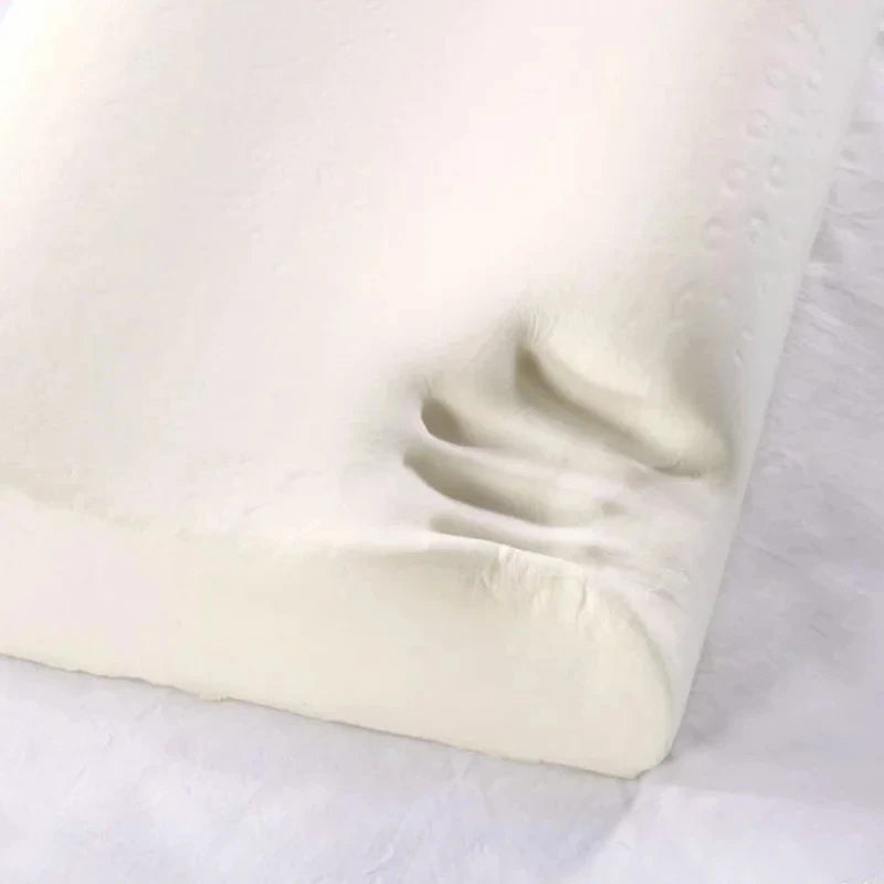 Close-up of a white fitted sheet on a bed