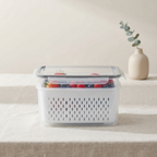 Storage container with lid on a table with a neutral background