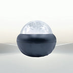 Spherical light fixture with a dark base on a white background