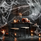 A dark, atmospheric Halloween scene with a wooden table covered in white spiderwebs, candles, pumpkins, skulls, and a large spider decoration on the wall.