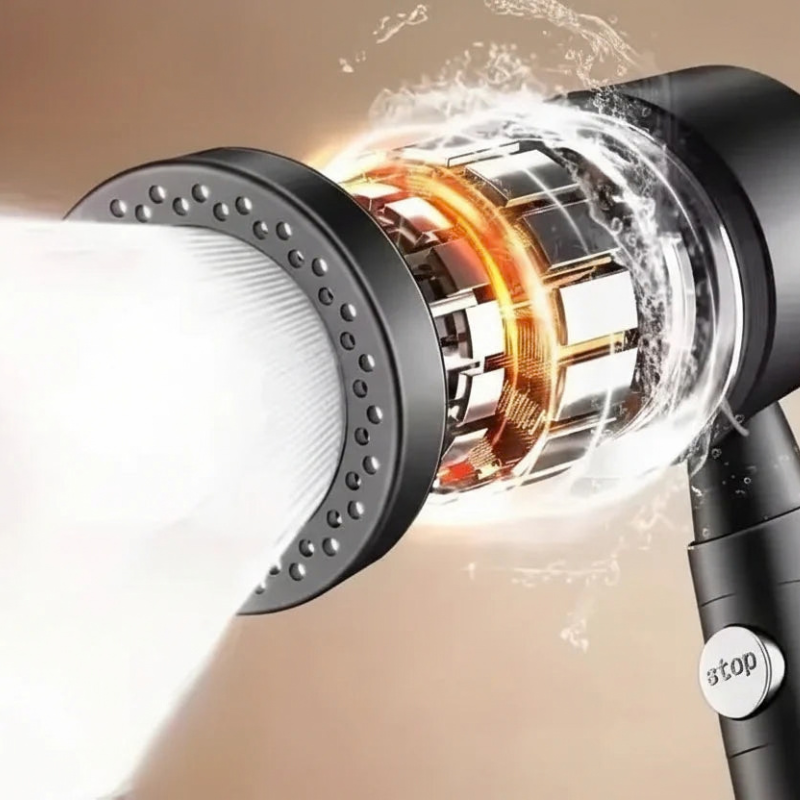 Close-up of a hair dryer with visible components and water spray.