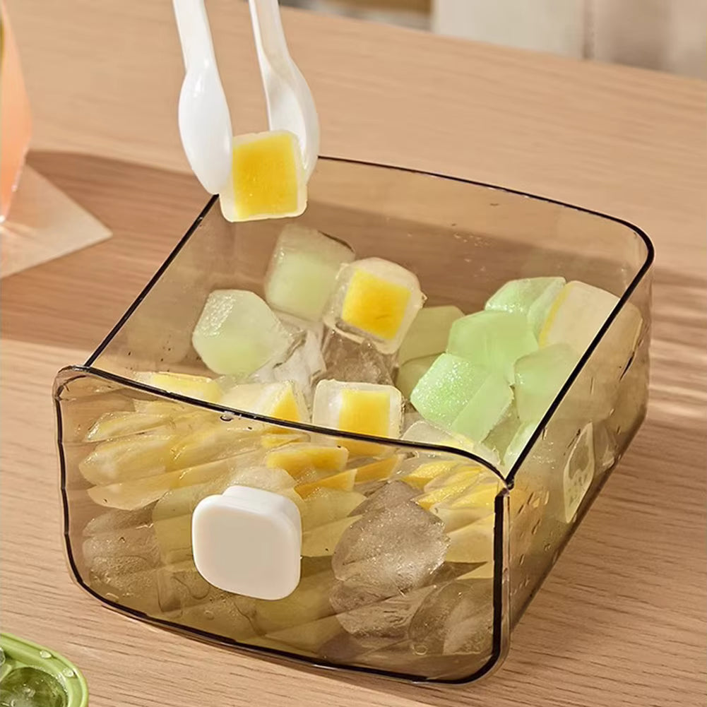 Clear container with ice cubes and yellow candies on a wooden surface