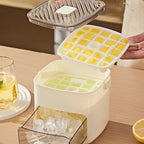 Ice cube tray with frozen cubes, open lid showing liquid, on a wooden surface.