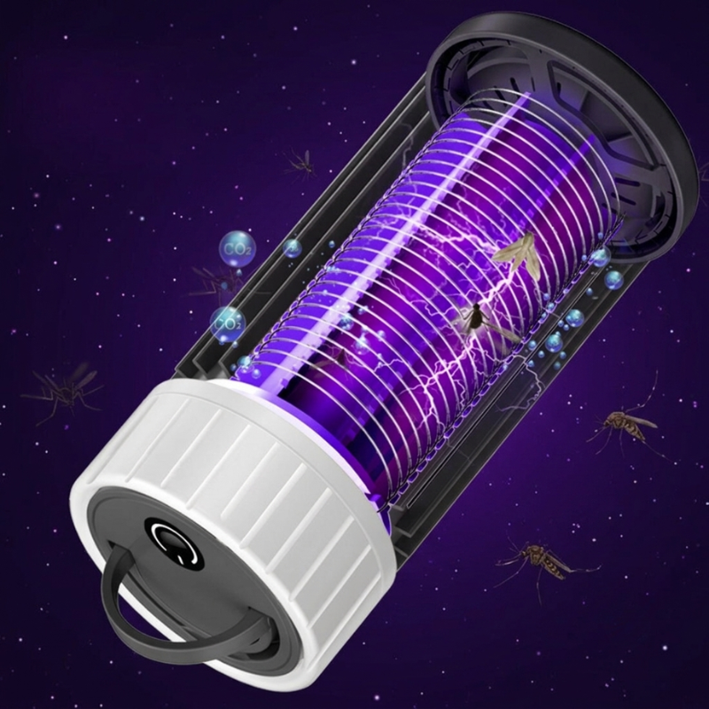 Insect zapper with purple light on a dark background