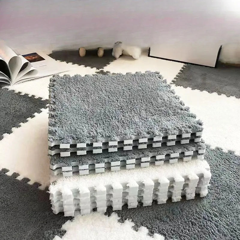 Stack of gray foam puzzle mats on a light-colored floor.
