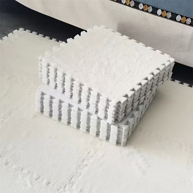 Stack of white interlocking foam mats on a light surface