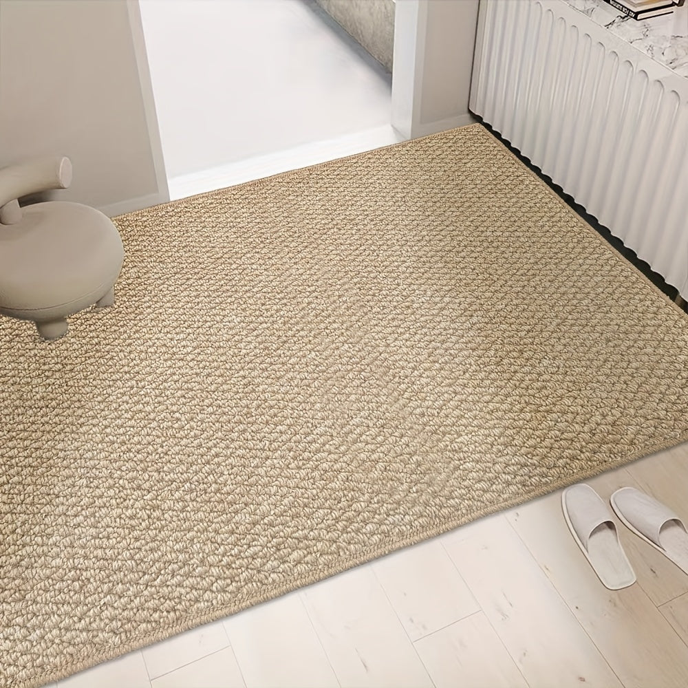Beige rug on a light wooden floor with a chair and white shoes in the foreground.