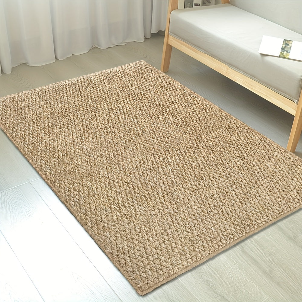 Beige woven rug on a light wooden floor with a chair in the background