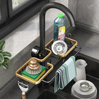 Modern kitchen sink with black faucet, dish soap, sponge, and towel holder.