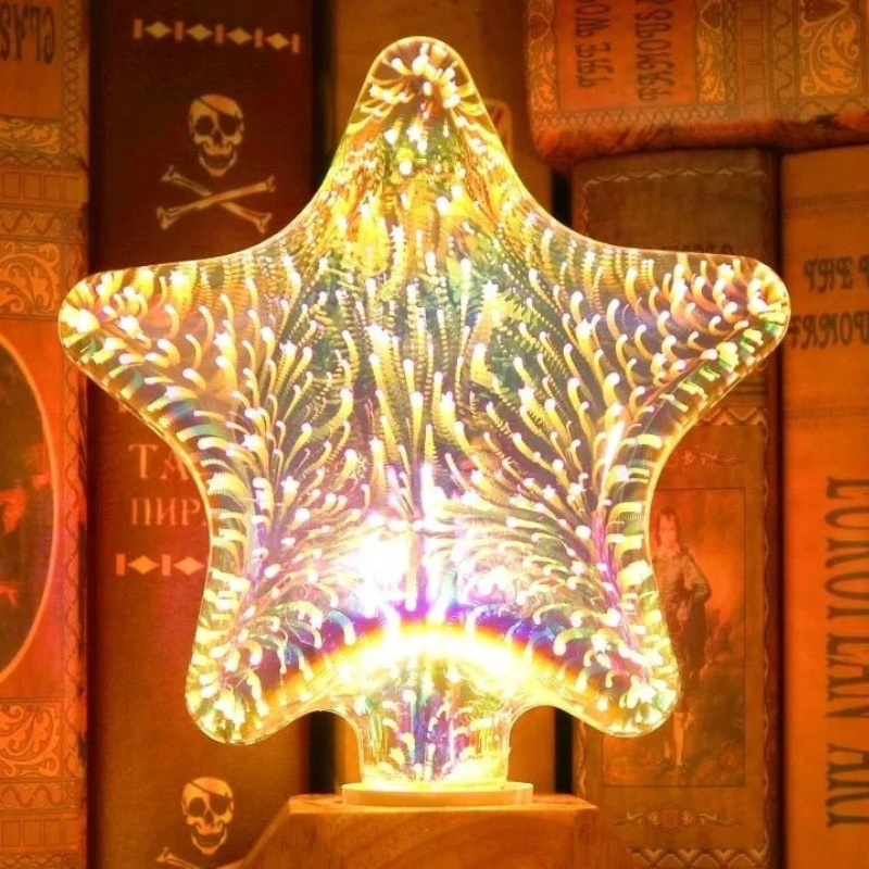 A star-shaped LED night light glowing with a multicolor iridescent pattern, displayed on a wooden base in front of a background of vintage books.