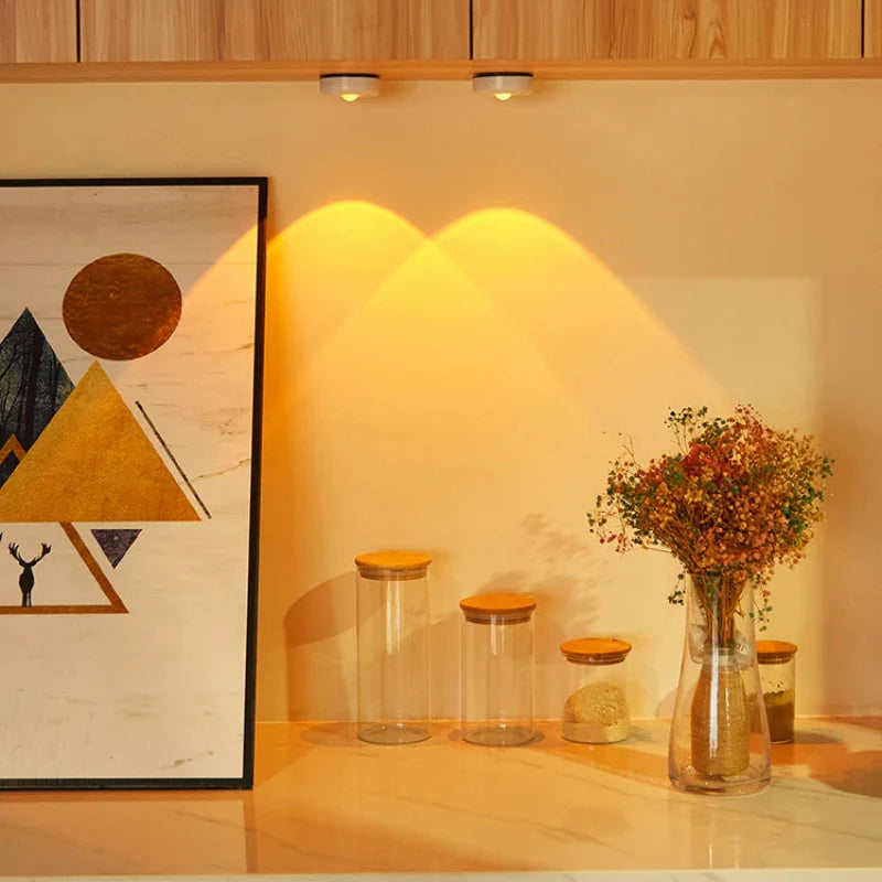 Decorative setup with jars and a vase on a shelf against a wall with abstract art.