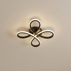 Modern ceiling light fixture with a decorative design on a neutral background