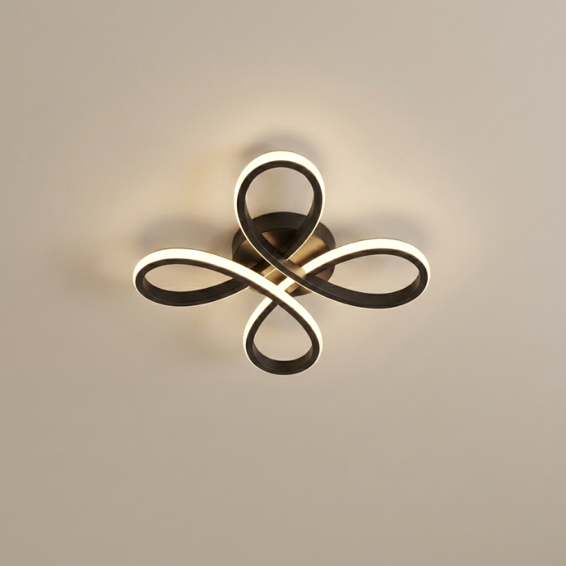 Modern ceiling light fixture with a decorative design on a neutral background