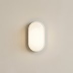 Wall-mounted light fixture on a plain wall