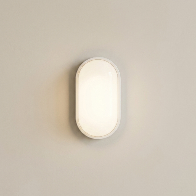 Wall-mounted light fixture on a plain wall