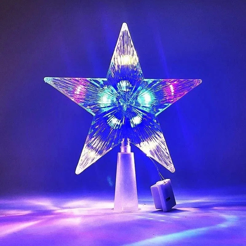 Colorful star-shaped Christmas tree topper on a dark background