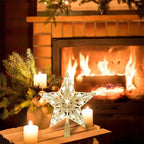 Decorative star with candles in front of a fireplace