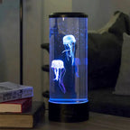 Jellyfish lamp on a table with books in the background