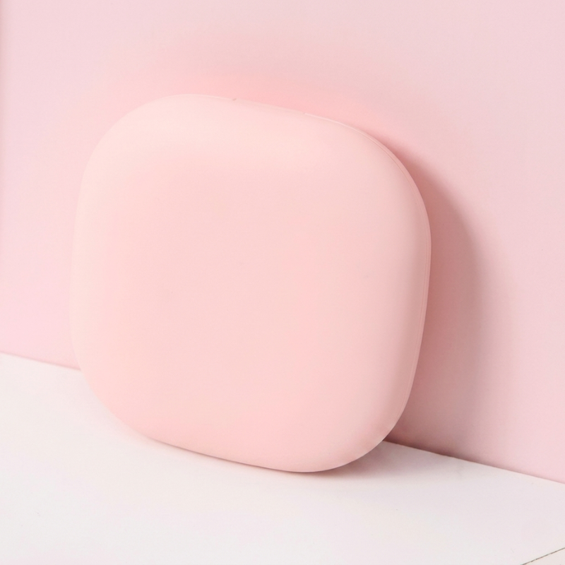 Pink oval object on a light pink background