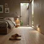 Modern bedroom with wooden floor, bed, and sliding glass door leading to outdoor area.