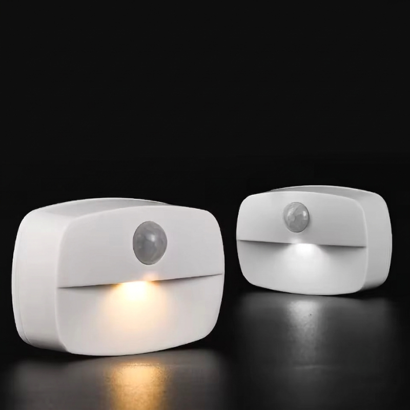 Two motion sensor lights on a black background