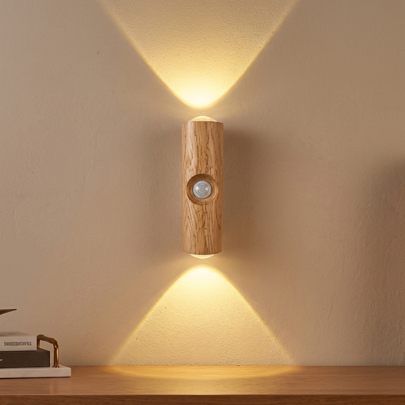 Wooden wall light fixture casting a warm glow on a neutral wall.