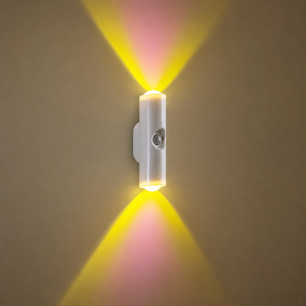 Wall-mounted light fixture casting a yellow glow on a beige wall