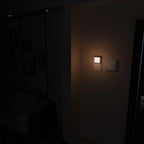 Dark room with a light switch on a wall