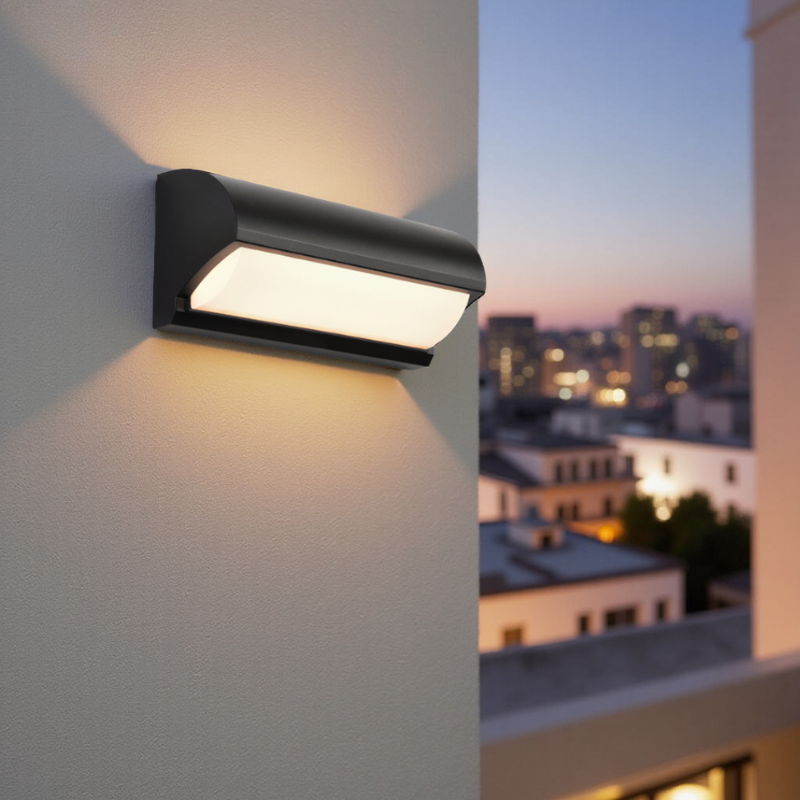 Black outdoor wall light fixture on a building exterior with cityscape in the background